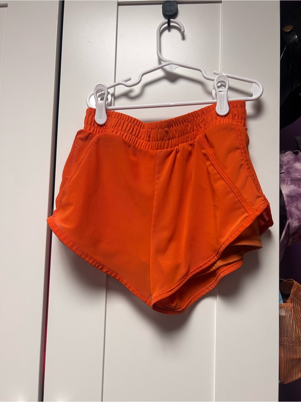 Women’s Orange Athletic Running Shorts with Elastic Waist. Missing drawstring